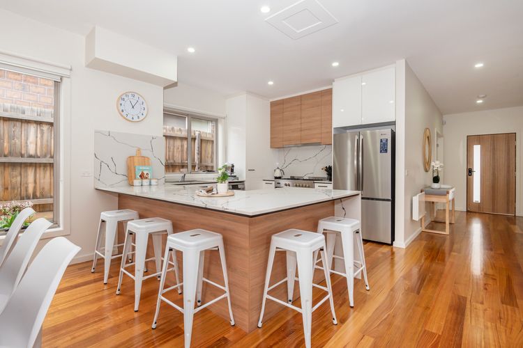Sleek kitchen area with breakfast bench seating