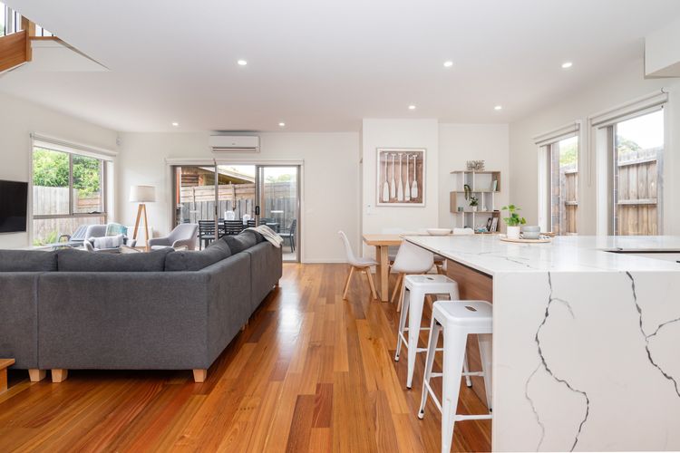 Downstairs features an open plan kitchen, living and dining area 
