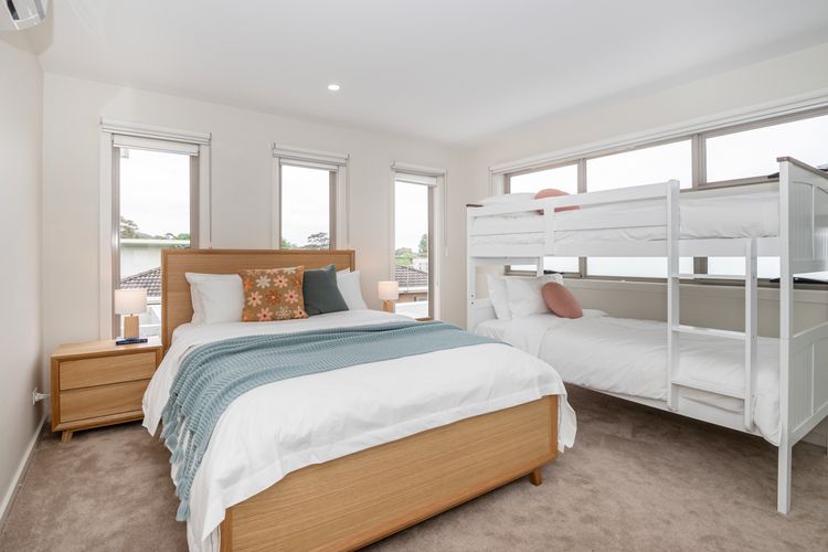Bedroom three with Queen bed and single bunk beds