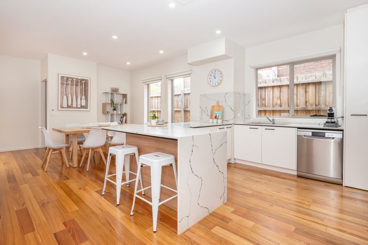 Fully equipped modern kitchen with stone benchtop and quality appliances
