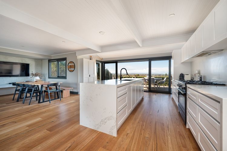 Kitchen and dining, leading out to balcony 