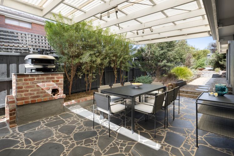 Alfresco dining table with pizza oven and BBQ