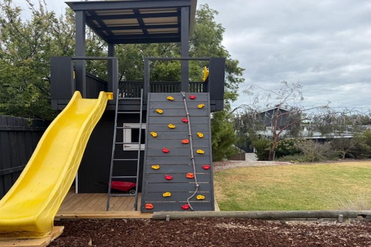 Amazing brand new Cubby for children with slide, climbing space and monkey bars!