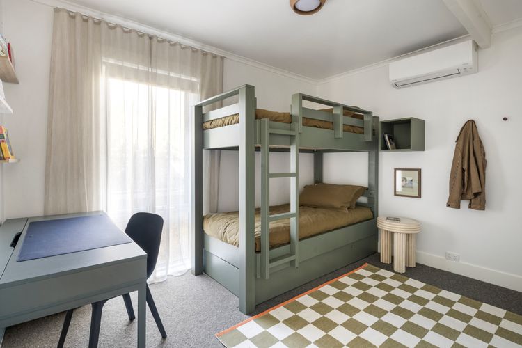 Bedroom three with Single bunk beds , a trundle bed and a study area