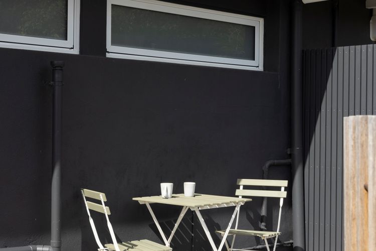 Outdoor seating area near pool