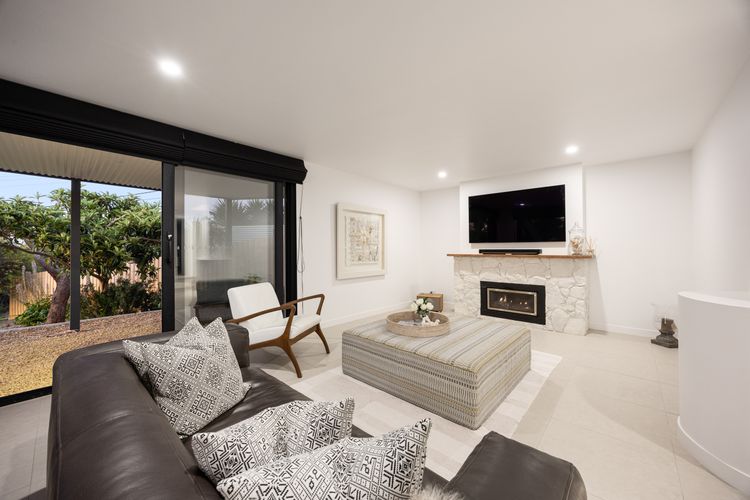 Downstairs living area with TV  & Gas Fireplace