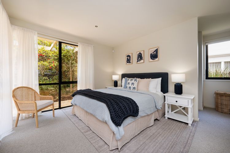 Master bedroom with a king bed 