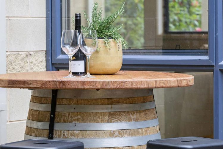 Enjoy a glass of wine under the olive tree