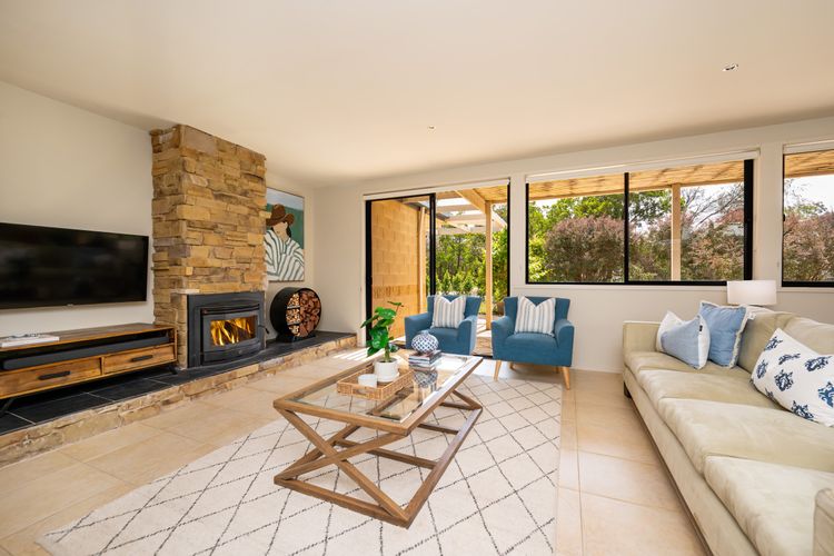 Living area with a smart TV and fireplace 