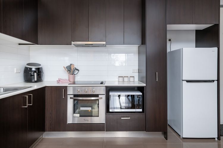 Fully equipped kitchen with microwave and oven and air fryer. 