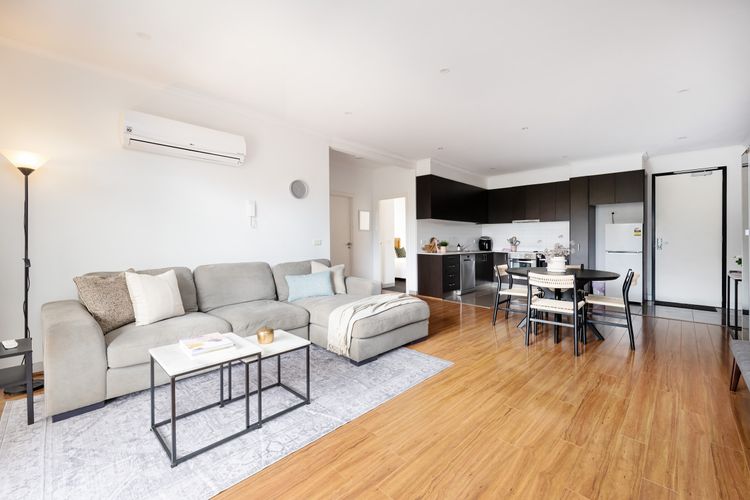 Living space with air conditioning and fully equipped kitchen 