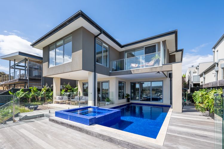 Property exterior showing the pool and spa