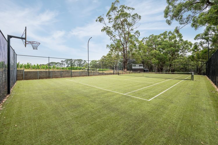 Full tennis court and basketball hoop 