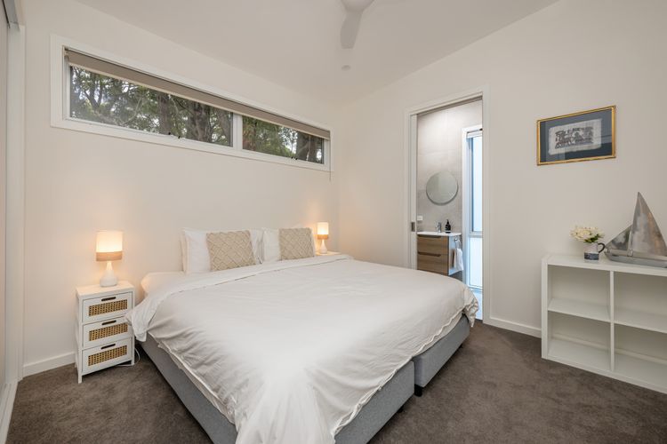 Bedroom three with king bed that can be spilt into two king single beds 