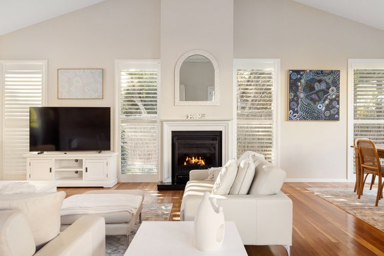 Lounge area with a smart TV and cosy gas fireplace