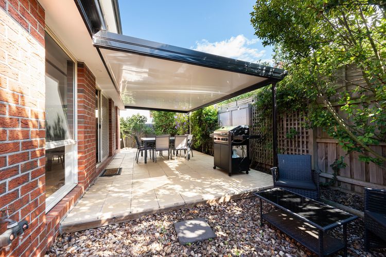 Undercover entertaining area with BBQ and seating for eight