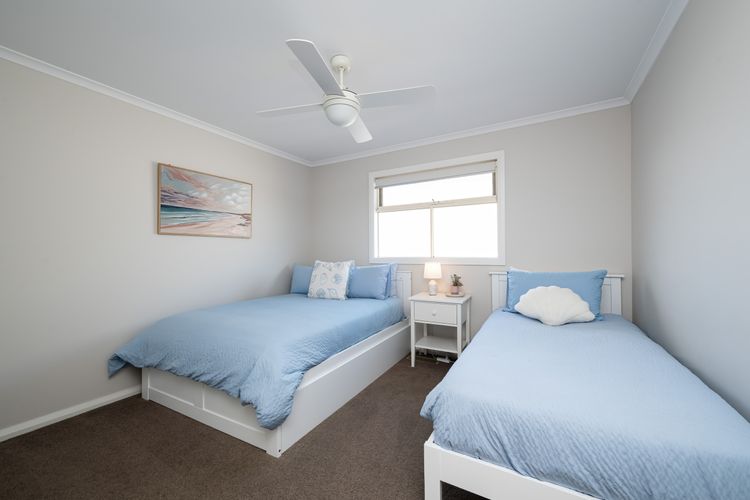 Bedroom two, with double bed and single bed located on the first floor.