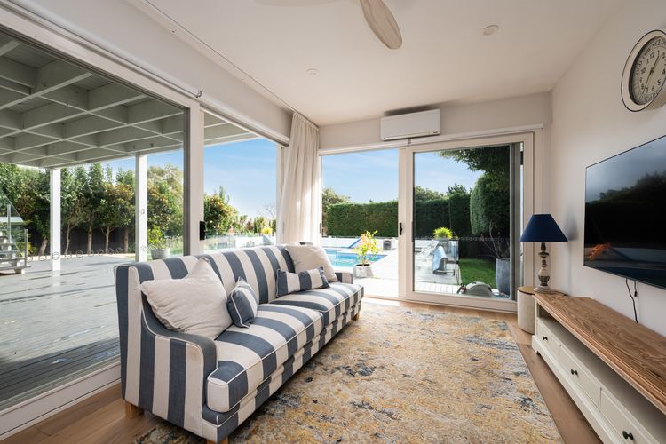 Downstairs Loungeroom with TV and access to Pool