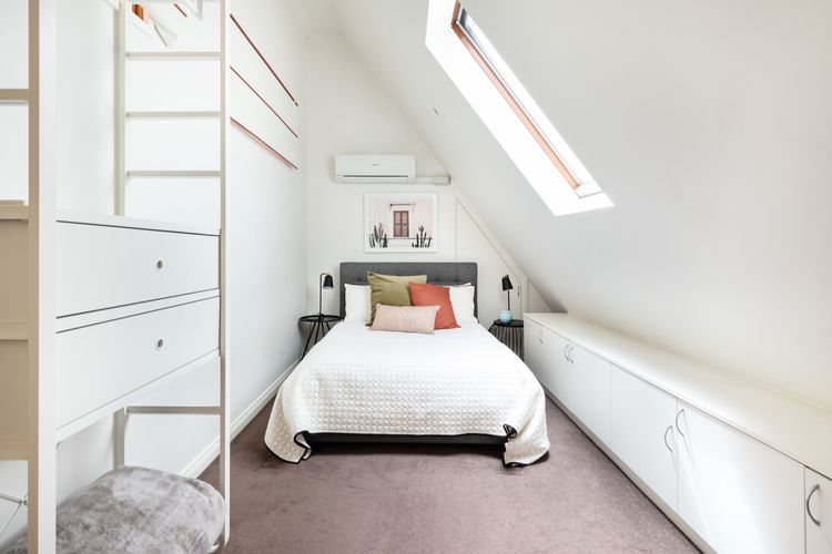 This bed is more than just a piece of furniture; it's a cocoon of comfort and tranquility.