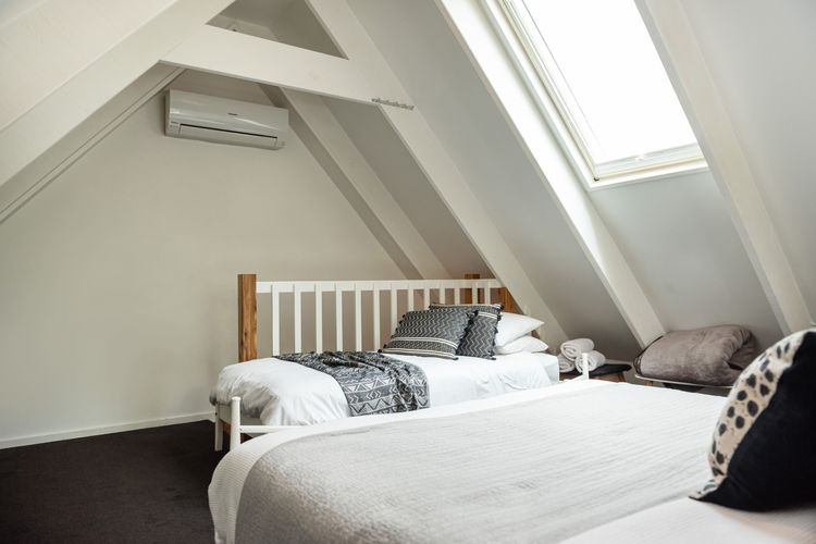 Welcome to our bedroom that features a queen size bed and single bed. 