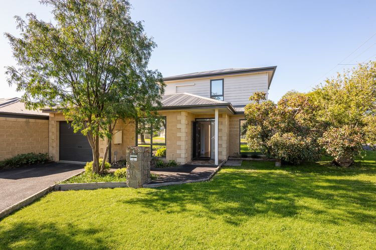 Spacious front yard with plenty of room for children to play and run around.