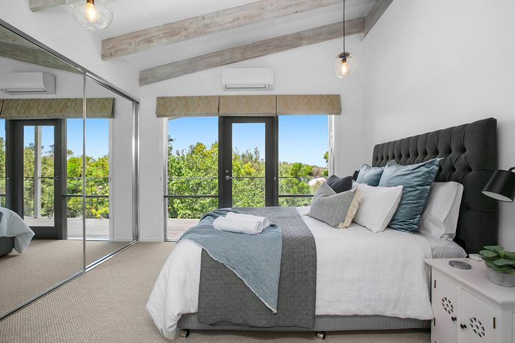 Indulge in luxury and comfort in our spacious bedroom.