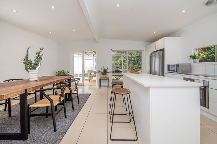 Fully equipped kitchen and dining area with seating for 5