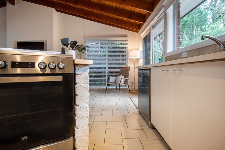 The centerpiece of the kitchen is a spacious and versatile cooking area.
