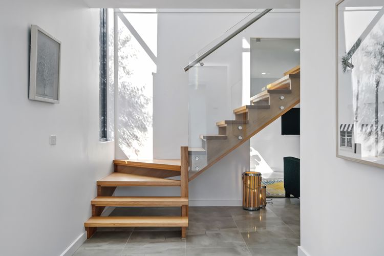 Beautifully designed staircase up to main living and kitchen. 