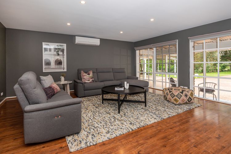 third living with TV and open fireplace