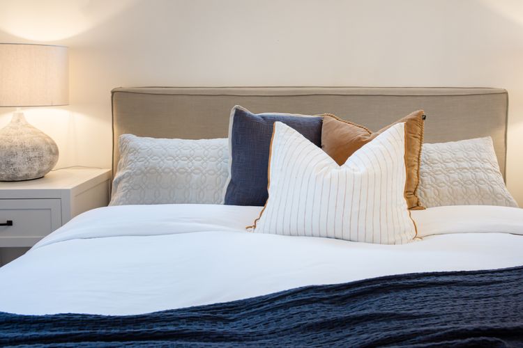 Enjoy the soft, high-quality king size bed with luxurious linens and plump pillows.