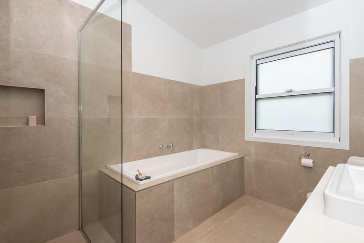 Main bathroom with bath and shower 