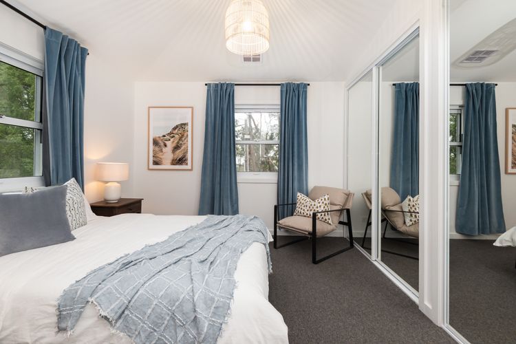 Welcome to our spacious bedroom, featuring our queen size bed.