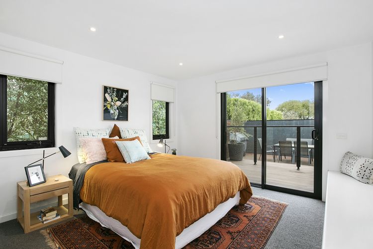 Fourth bedroom with queen bed and bathroom.