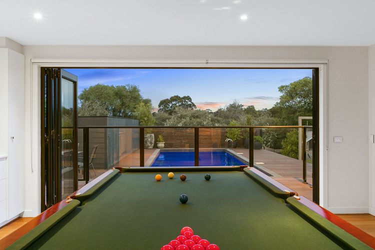 Full sized billiard table opening out to solar heated pool