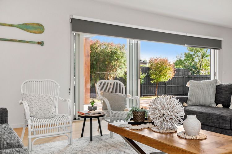 Living area with bi-fold doors leading to outdoor entertaining area