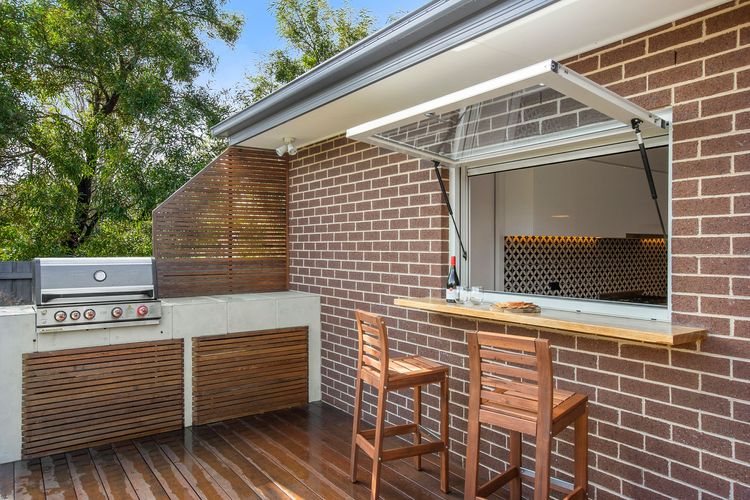 entertaining deck with a built-in barbecue & bar table