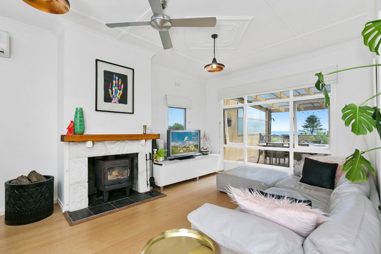 Living area with open fireplace and Smart TV