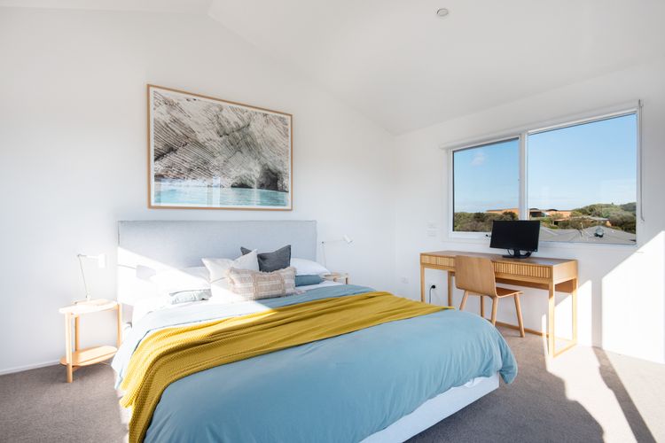 Master bedroom with king bed and dedicated desk space
