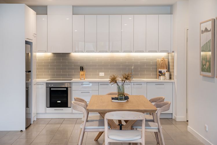 Two steps from the table to the kitchen. Can't get any easier. 
