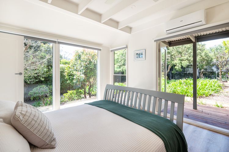 Bedroom one has a queen bed and has a split-type air conditioner