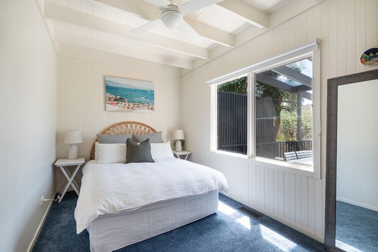 Bedroom 3 has a queen bed and a ceiling fan 