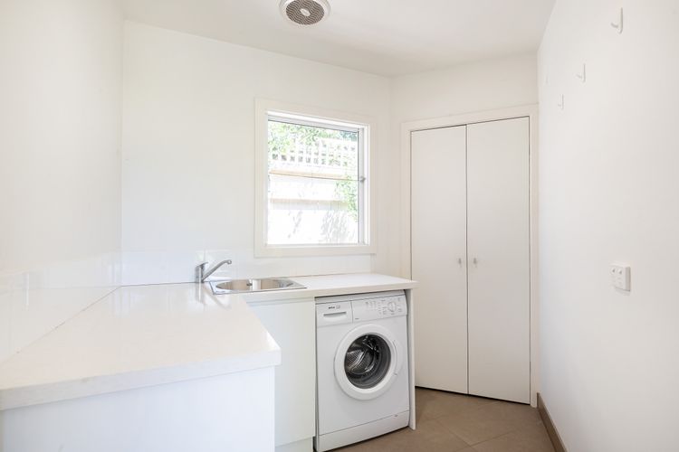 A mini-laundry room with washing machine and dryer