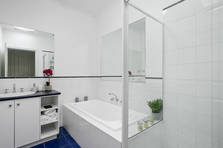 Main bathroom with bath and shower