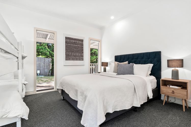 Bedroom Six with queen bed, single low bunk and single bed