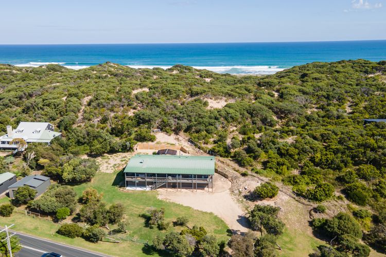 Walk across the sand dunes to the beach 