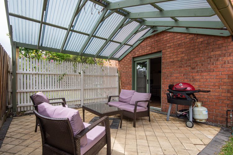 Backyard outdoor seating with BBQ