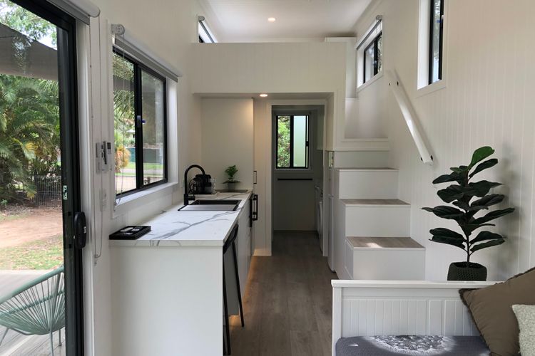 Open plan living area and steps to the bed