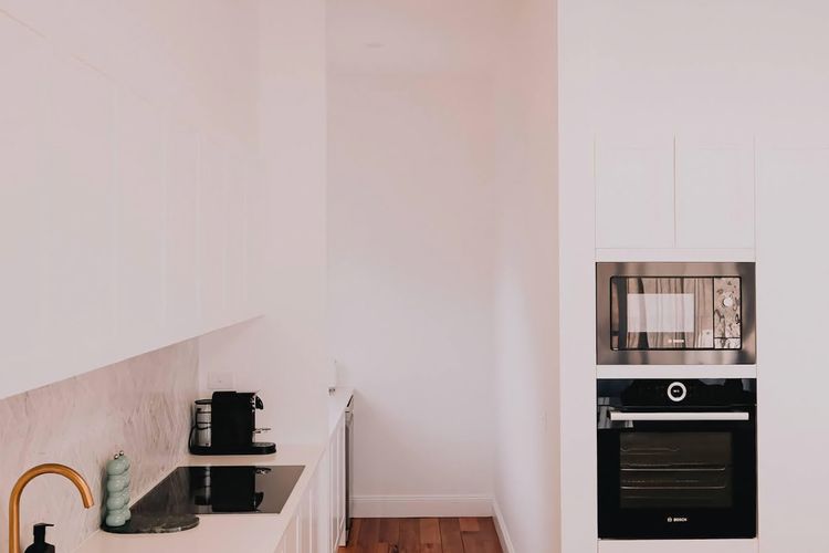 Looking through to the butlers pantry - you will find a secondary sink, dishwasher, the kettle & toaster and of course the coffee station.