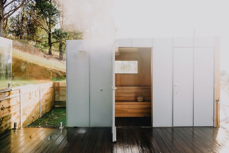 Outdoor electric Sauna with outdoor shower (hot water) - outdoor powder room behind the door to the right.